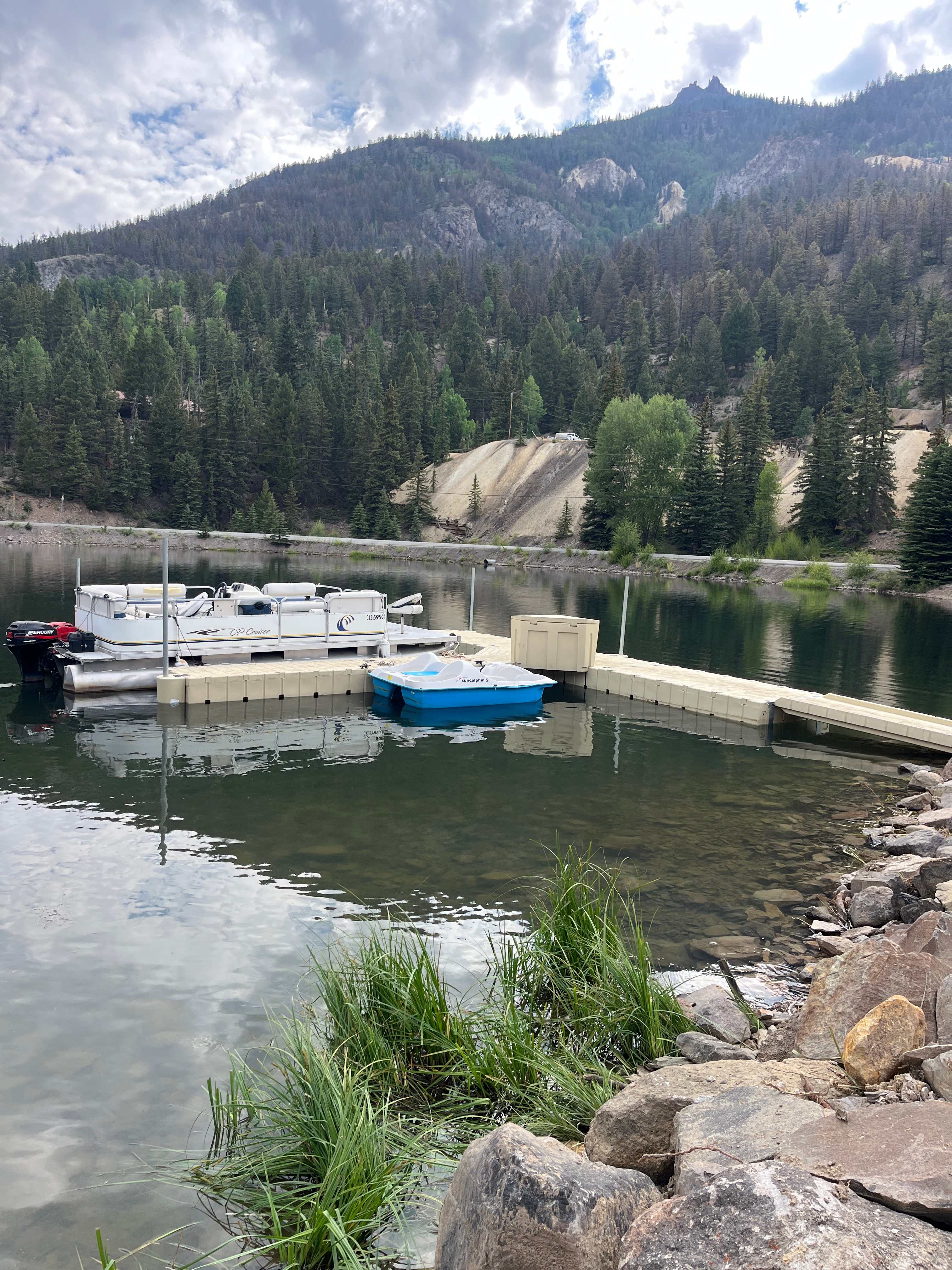 Modular EZ Dock system with a pontoon boat and pedal boat on a Colorado mountain lake